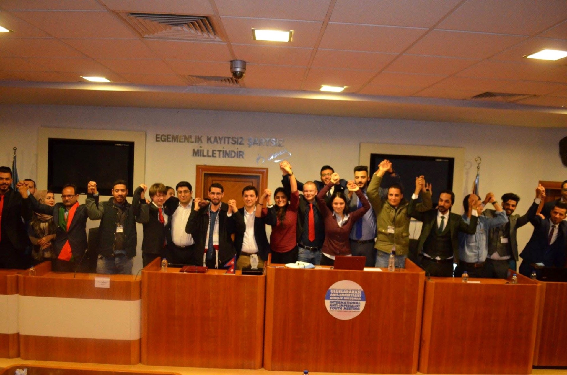 Young delegates raising their fists, 2018